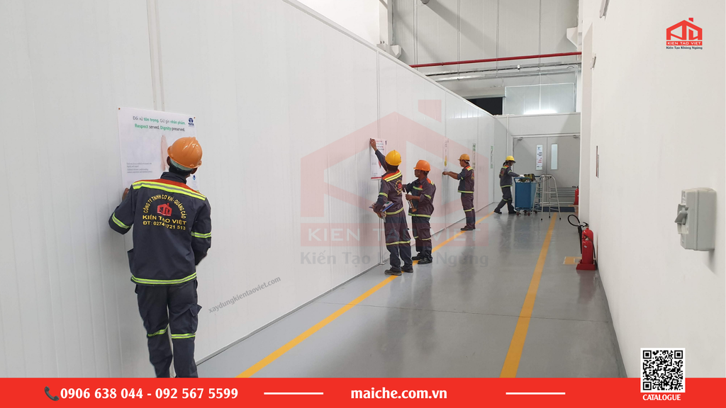 Overview of the Kien Tao Viet team installing safety signs at a factory in Ho Chi Minh City.